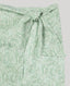 Green paisley patterned fabric on a light gray background