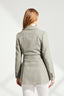Back of Model wearing Sage Green Safari Jacket with tortoiseshell buttons and belt buckle with white trousers and silk blouse 