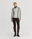 Model wearing Jasmine Lambswool V-Neck Sweater in Swansdown Ivory with Loden Green Stitch 