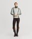 Model wearing Jasmine Lambswool V-Neck Sweater in Swansdown Ivory with Loden Green Stitch 