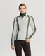 Model wearing Jasmine Lambswool V-Neck Sweater in Swansdown Ivory with Loden Green Stitch 