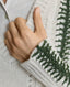 Model wearing Jasmine Lambswool V-Neck Sweater in Swansdown Ivory with Loden Green Stitch 