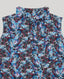Close-up on tie neck detail on Blue butterfly patterned silk sleeveless tie neck blouse on a light grey background