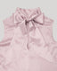 Close-up on tie neck detail on silk sleeveless blouse 