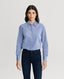 Model wearing Spencer-Stretch Corduroy Shirt in Ice Blue featuring mother of pearl buttons with navy trousers 