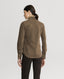 Back of Model wearing Spencer-Stretch Corduroy Shirt in Khaki featuring mother of pearl buttons with brown trousers 