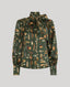 A long-sleeve button-up blouse with a high collar and large front bow, covered in an all-over feather print on a dark olive green base. The print features brown, beige, and white feathers.
