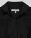 Black shirt with 'Really Wild' label on a gray background