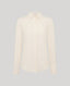 An off-white long-sleeve button-down shirt with a classic pointed collar, displayed on a neutral light gray background.