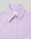 Close-up of a lilac and white micro-check patterned dress shirt  showing the collar, buttons, and inner neck label against a neutral gray background.