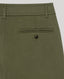 Close-up of a black trousers with a plain background