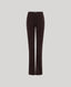 Dark brown corduroy flare pants shown on a neutral light gray background.