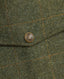 Close-up of the Branded metal poppers on the Highlander Tweed Field coat pocket in Moss Green and Orange check 