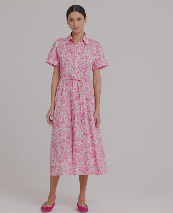 Video of a model wearing the Isabelle Floral Cotton Shirt Dress In Pink.